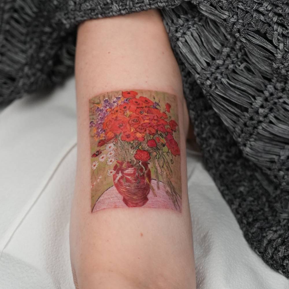 Van Gogh's 'Red Poppies and Daisies' tattooed on the bicep.