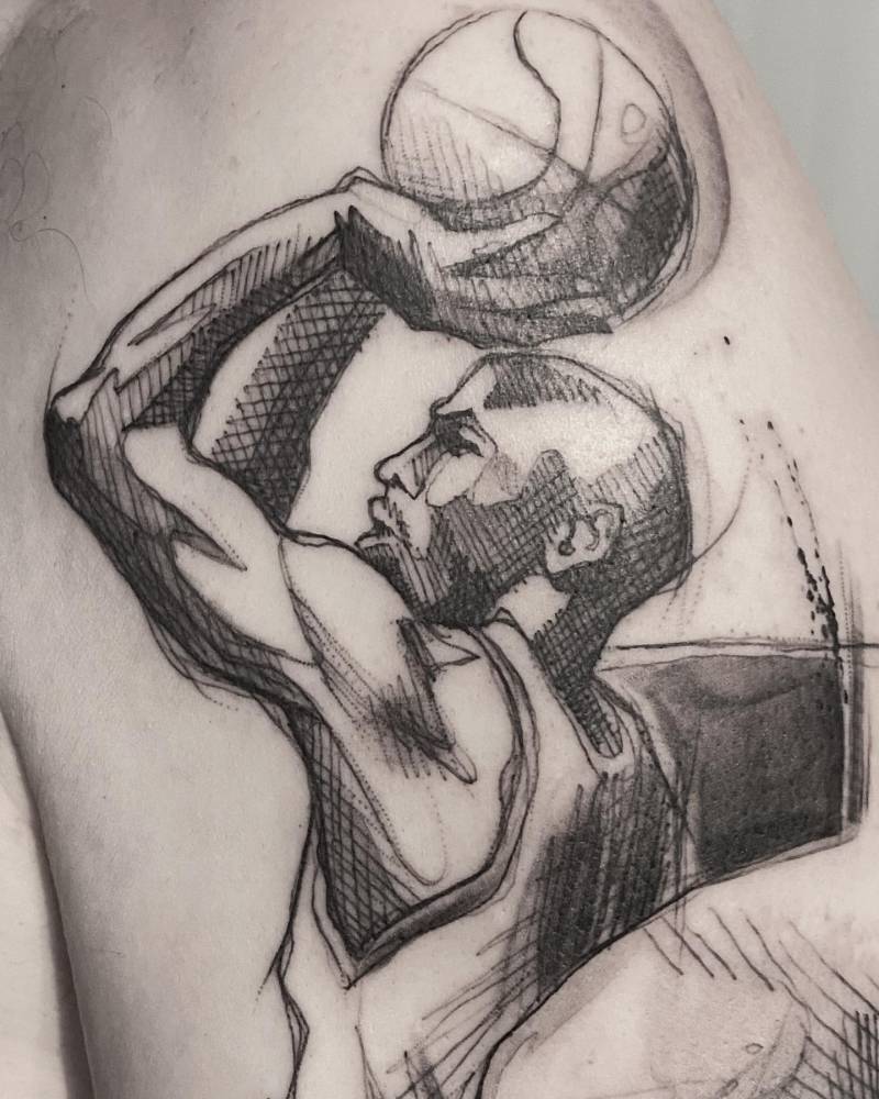 Sketch work style Michael Jordan tattoo located on the upper arm.