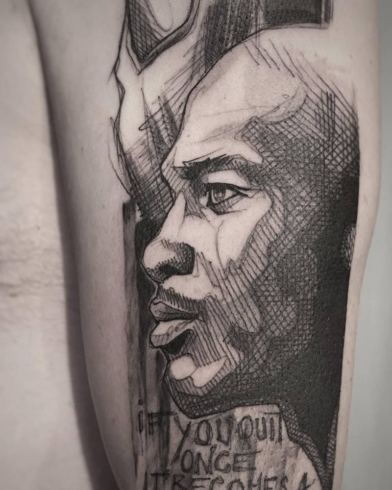 Sketch work style Michael Jordan tattoo located on the upper arm.