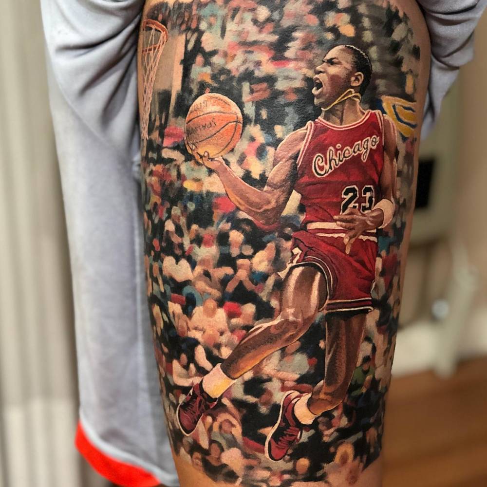Michael Jordan tattoo done on the thigh, realistic style.