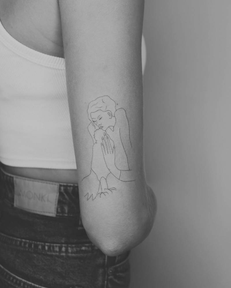 Tattoo based on her mother's version of ‘Woman with a Crow’ by Picasso.