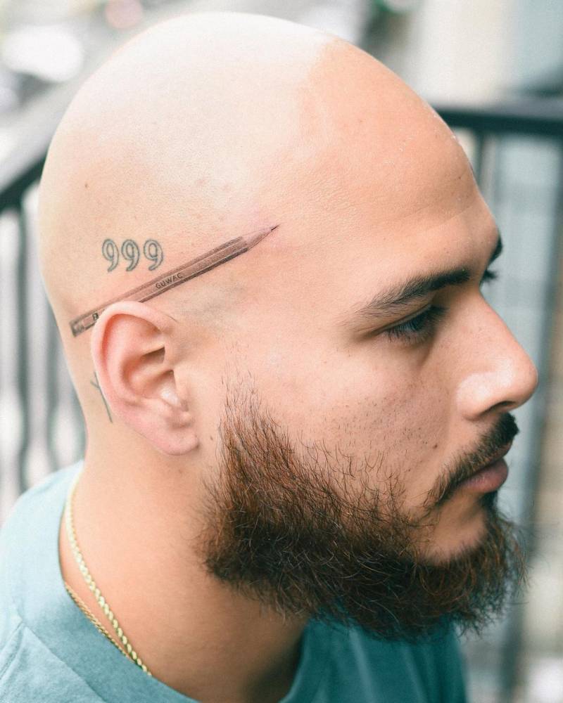 Micro-realistic style pencil tattoo located on the head.