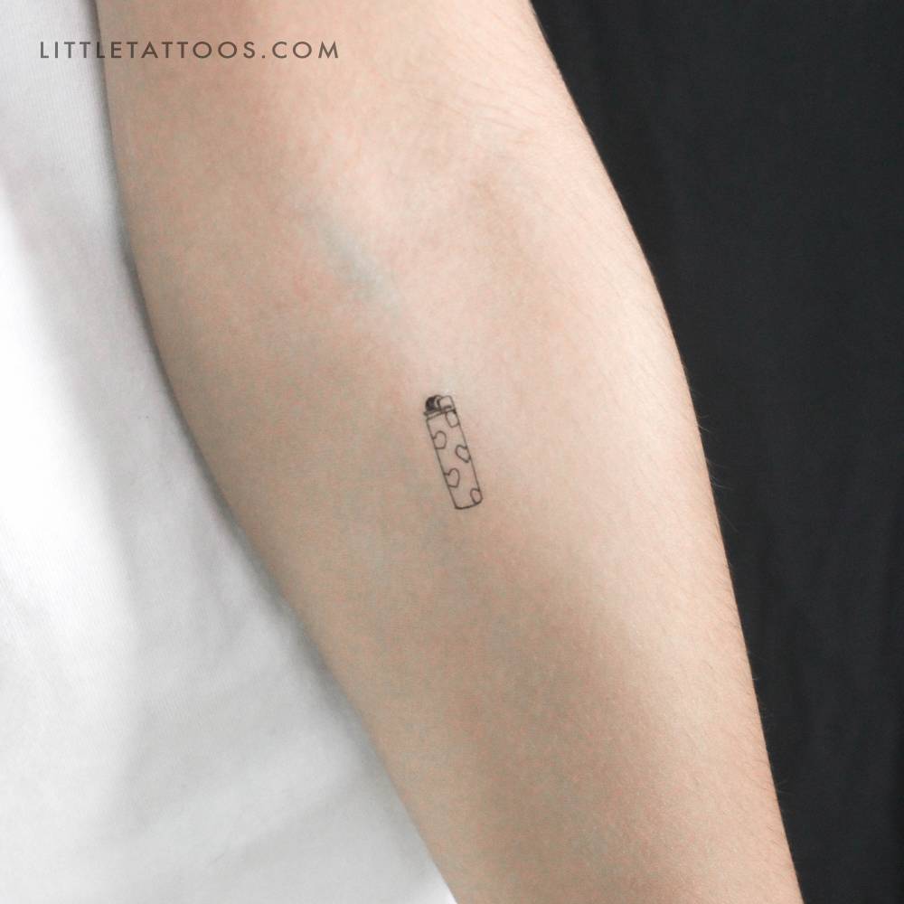 Lighter temporary tattoo located on the inner forearm.