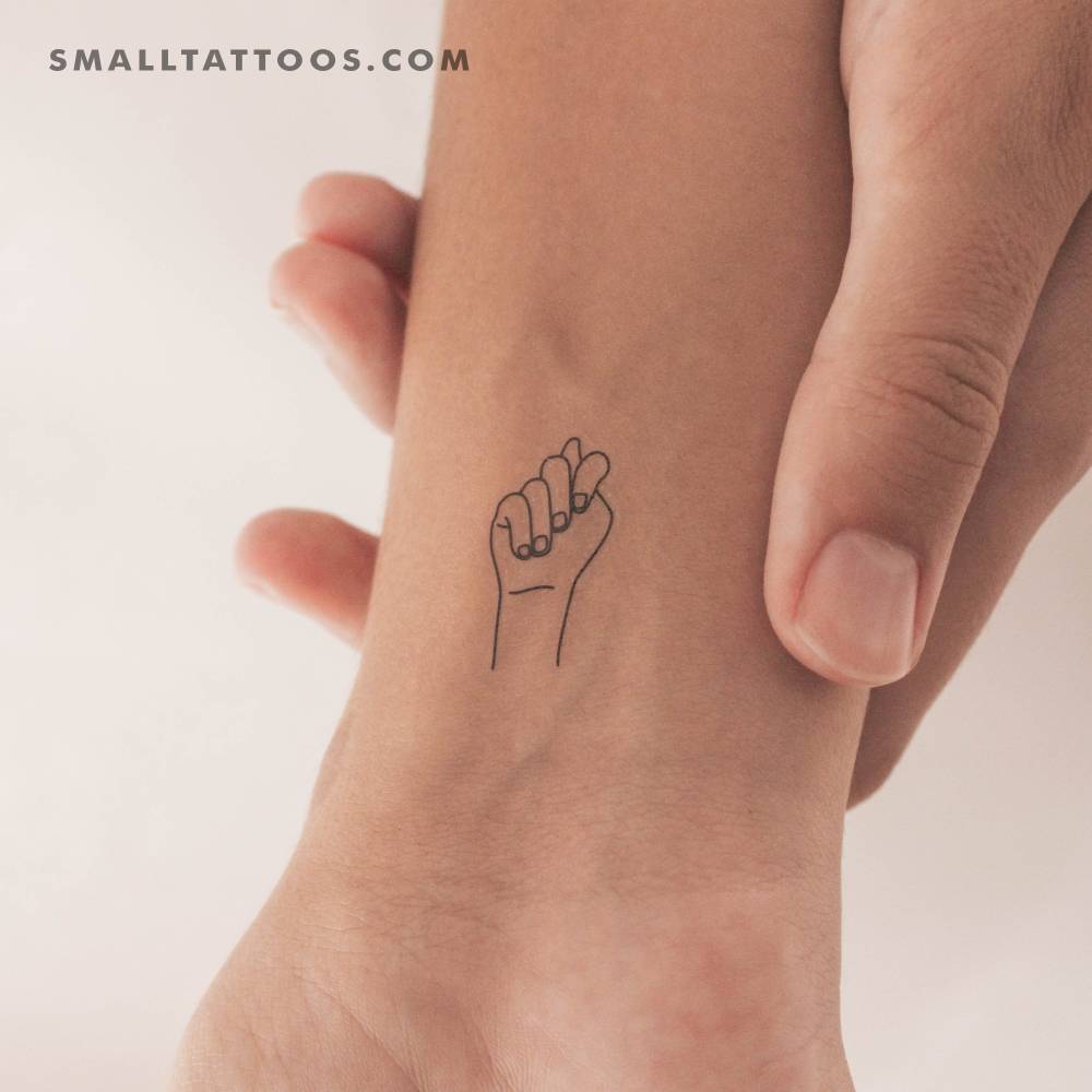 Sign Language "T" temporary tattoo located on the wrist.