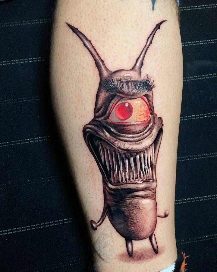 Realistic monster tattoo on the shin