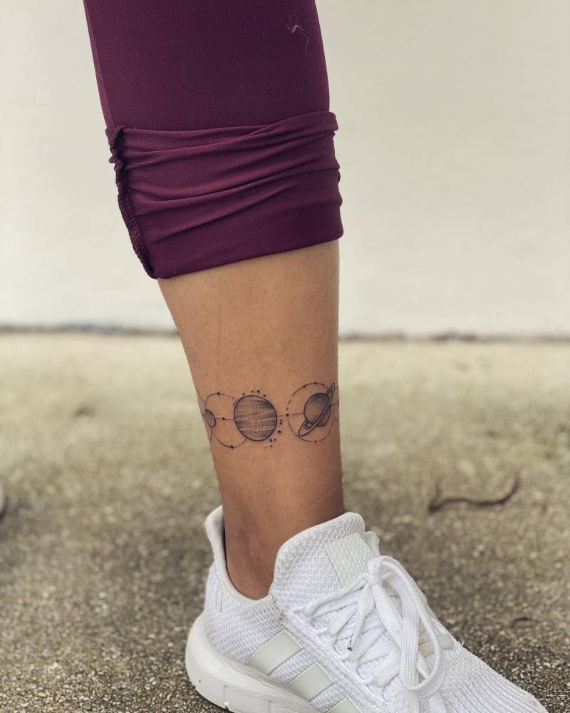 Solar system tattoo on the ankle