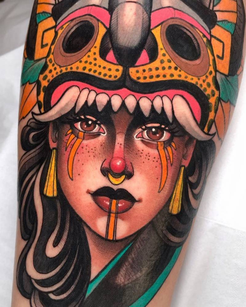 Native american woman tattooed on the shin