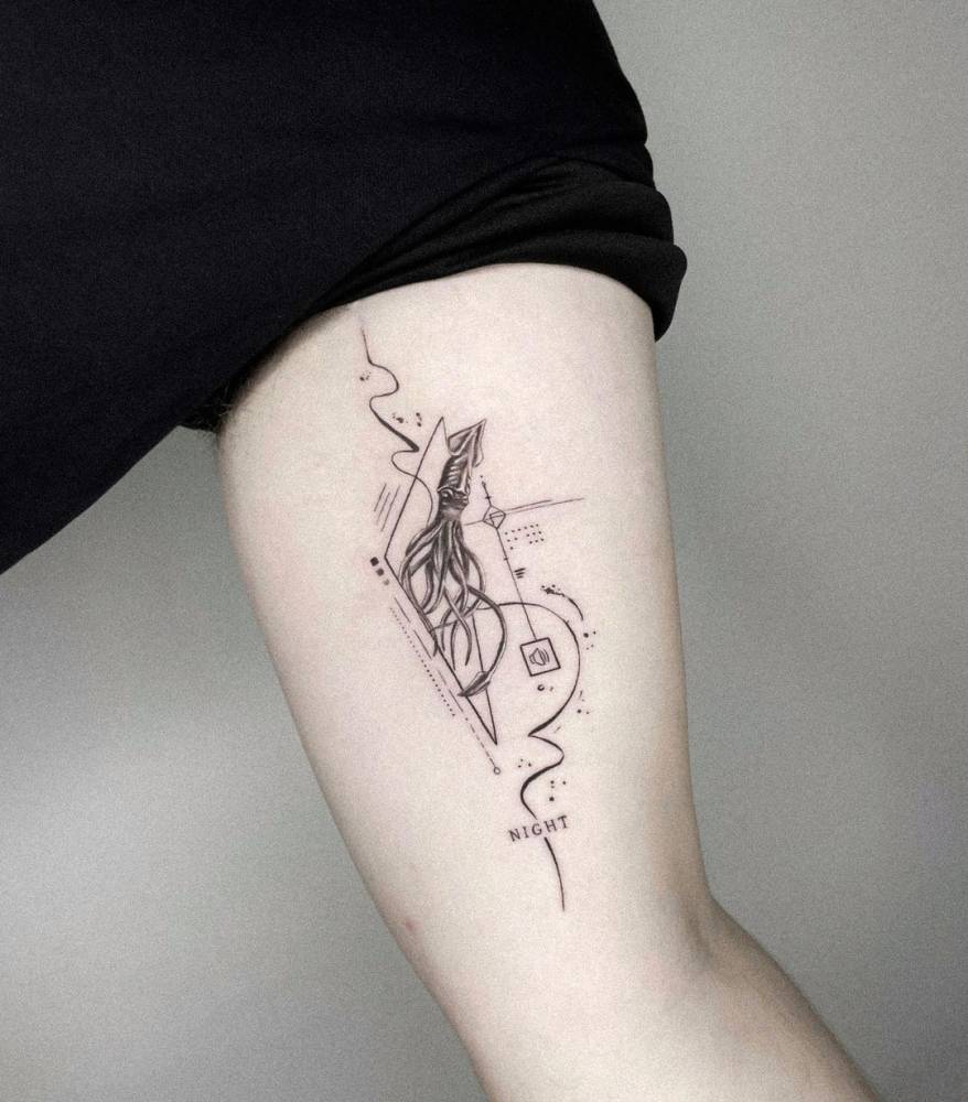 Graphic style squid tattoo located on the inner arm.
