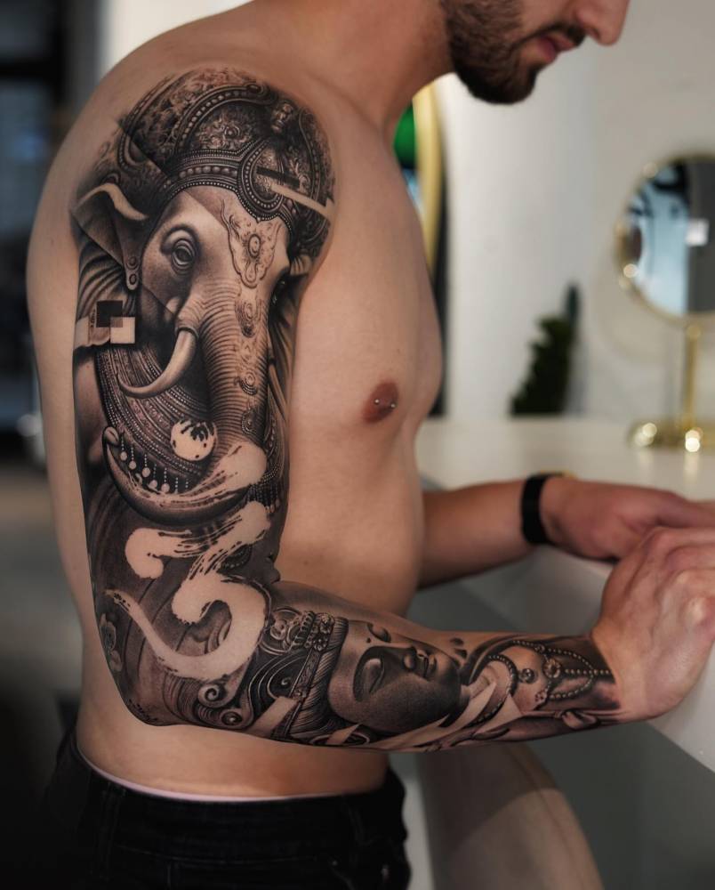 Ganesha and Buddha tattoo sleeve done in black and grey style.