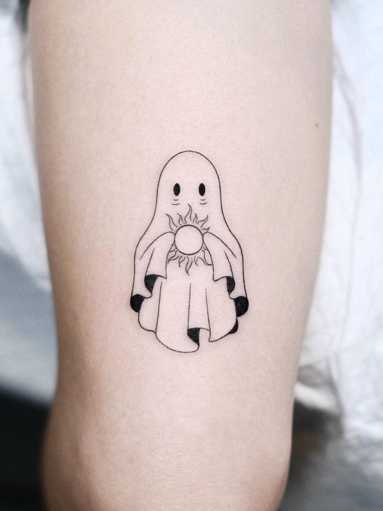 Ghost tattoo in illustrative style located on the tricep.