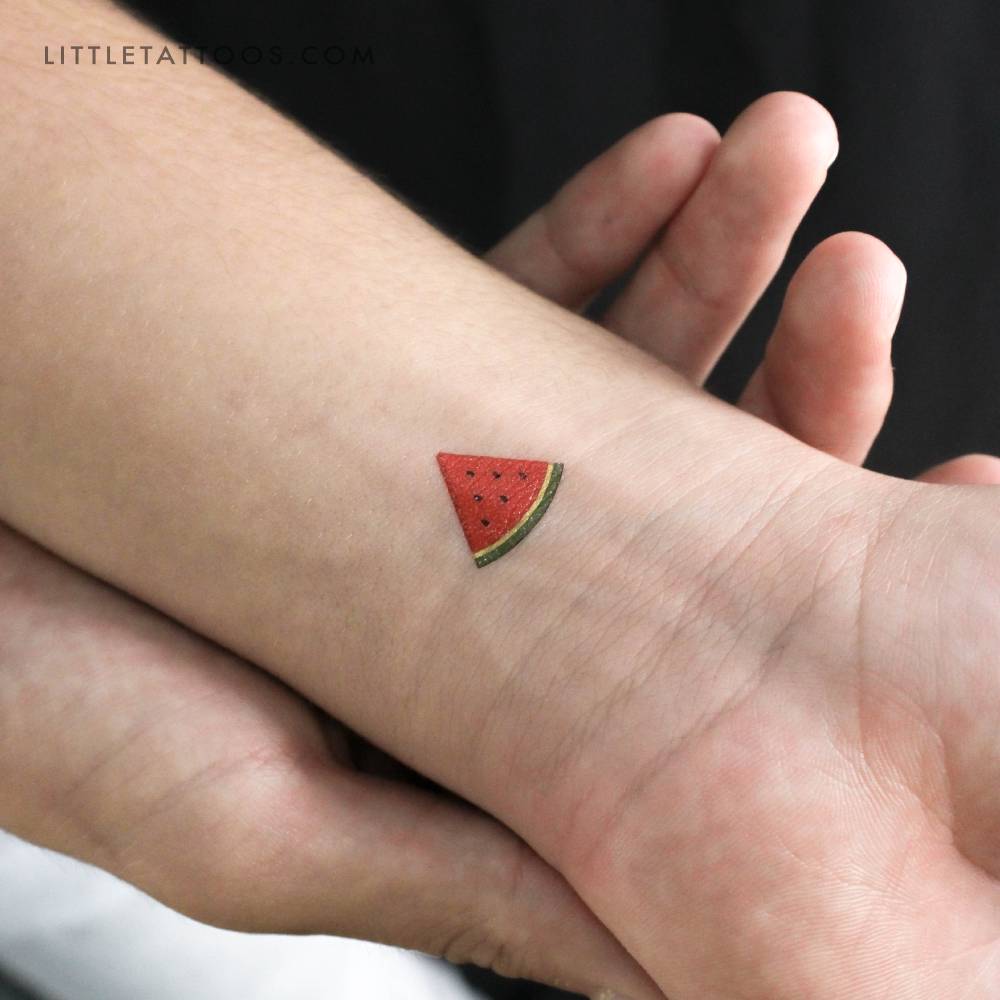 Watermelon slice temporary tattoo located on the wrist.