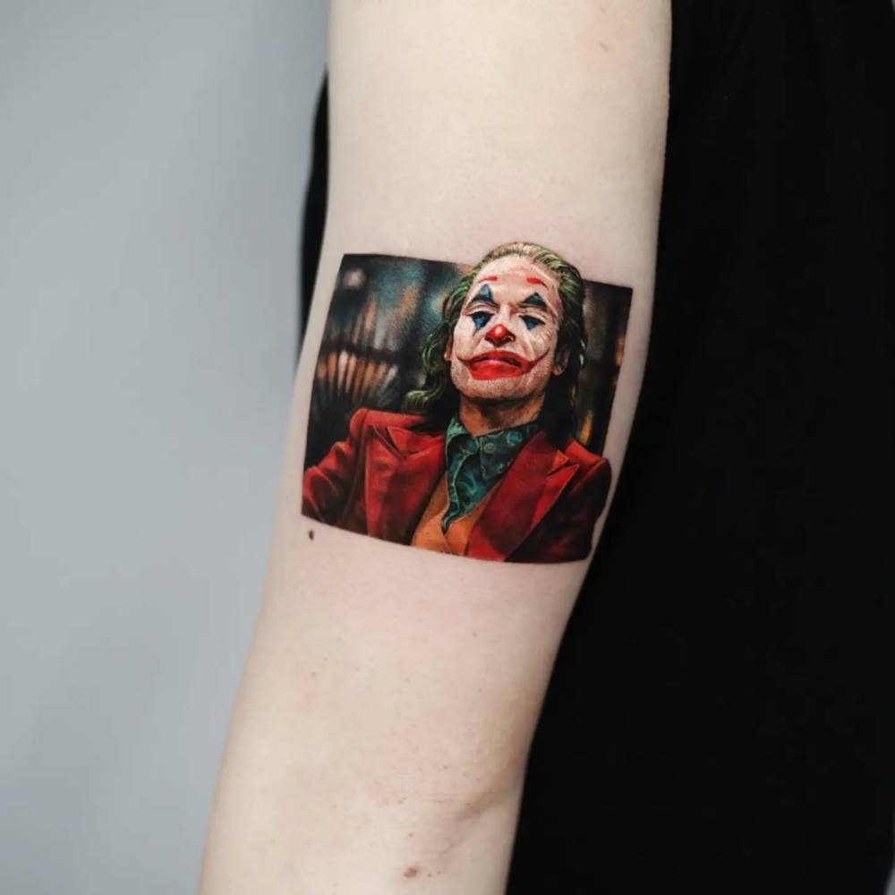 Joaquin Phoenix as The Joker tattooed on the upper arm.