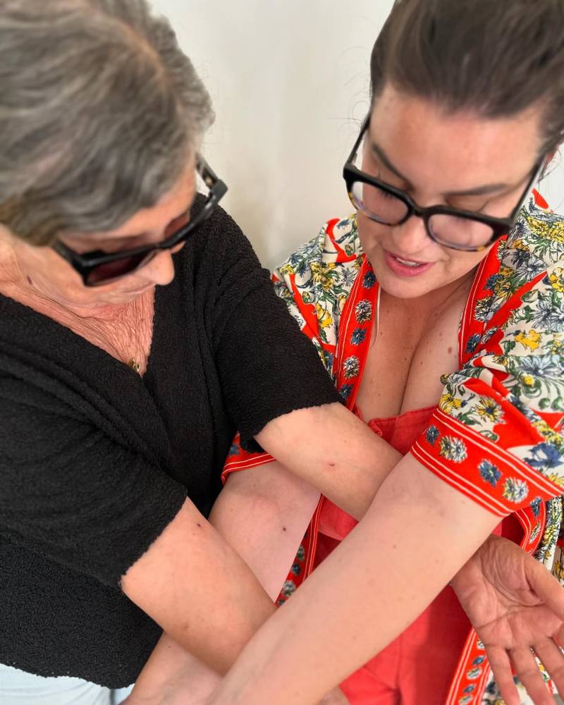 Matching initials tattoo for mother and daughter.