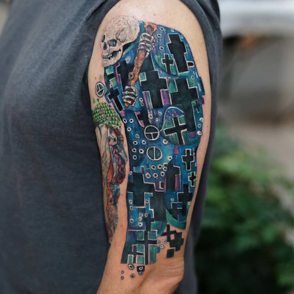 Klimt's 'Death and Life' tattoo located on the upper arm.
