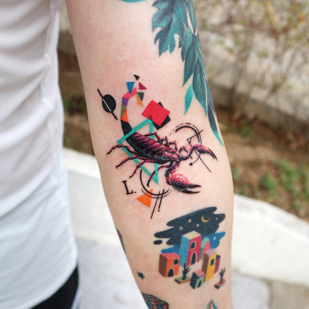 Graphic style scorpion tattoo placed on the inner forearm.