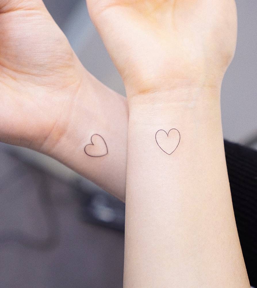 Matching minimalist hearts tattoo for best friends.