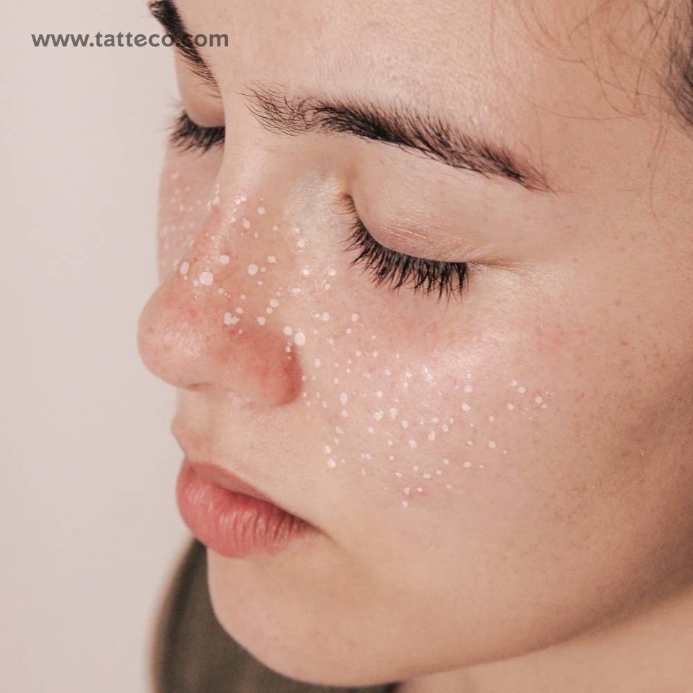 White freckles temporary tattoo located on the face.