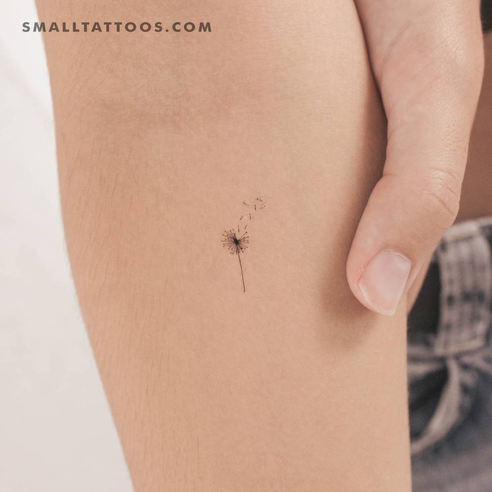Small minimalistic dandelion temporary tattoo located on the wrist.