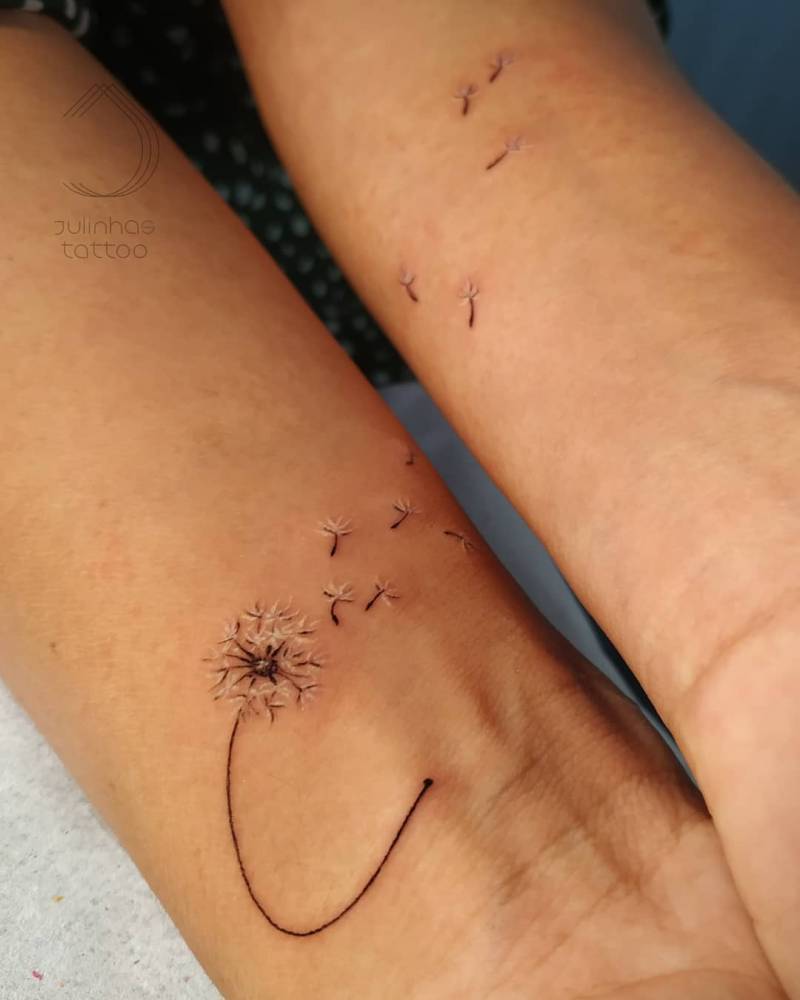 Individual matching dandelion seeds tattoo done in fine line.