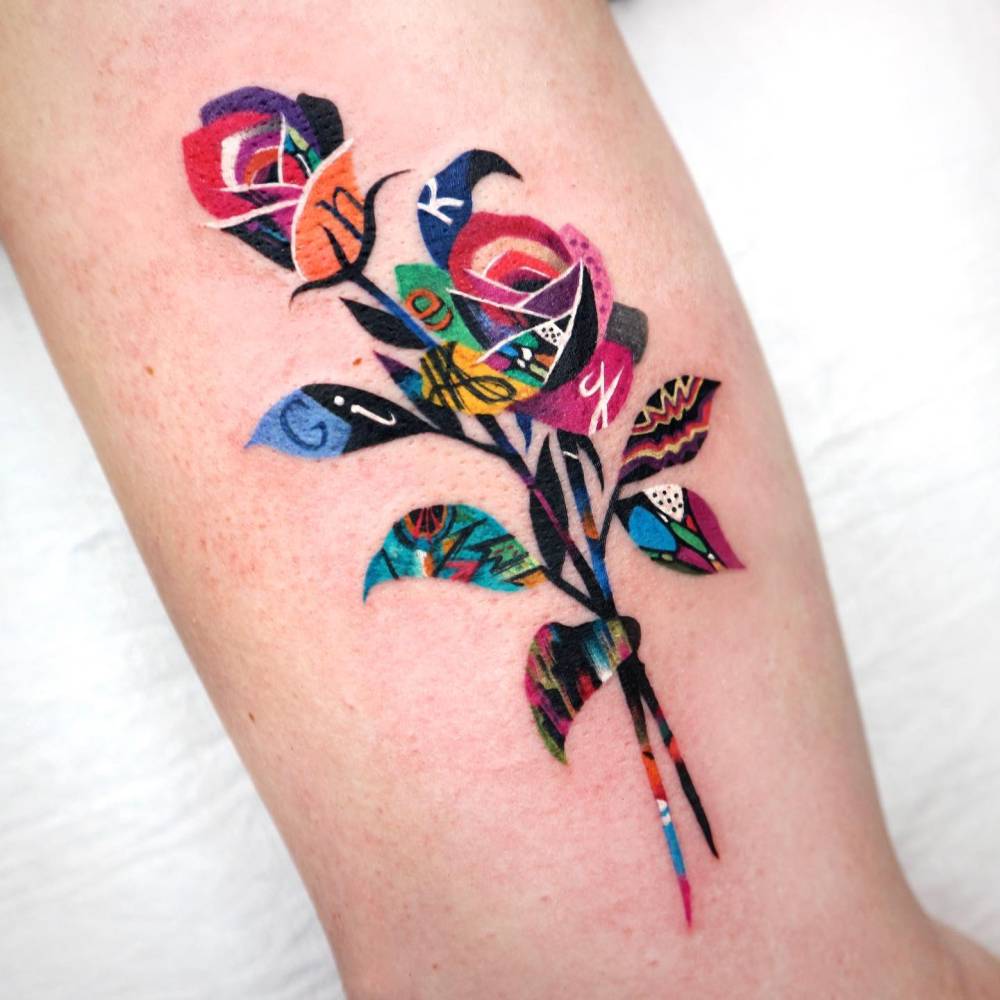 Collage style roses tattoo located on the upper arm.