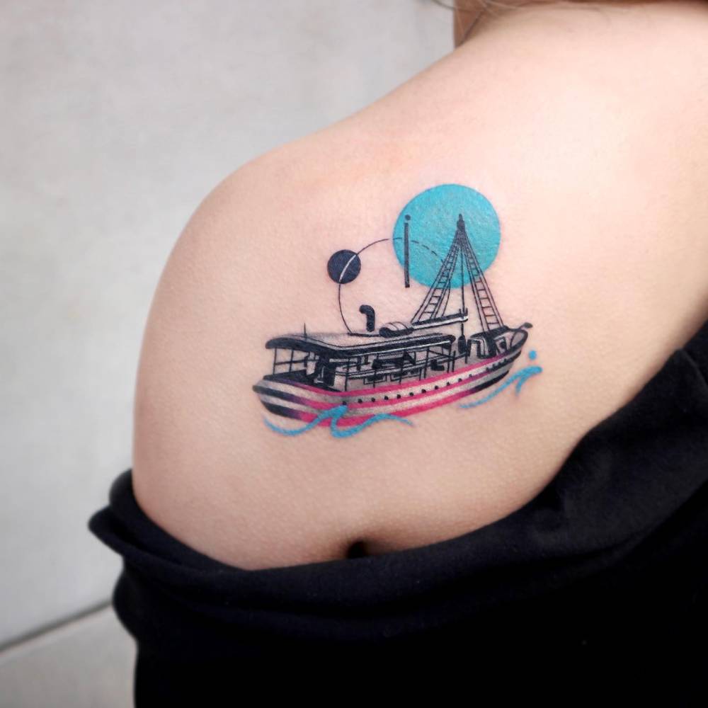 Boat tattoo in graphic style located on the shoulder blade.