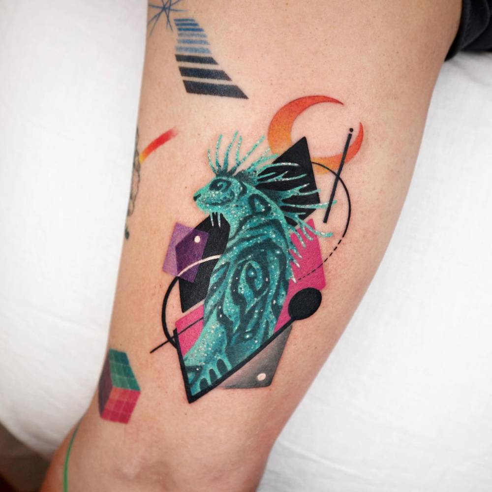 Forest spirit / Night walker in graphic style tattooed on the upper arm.