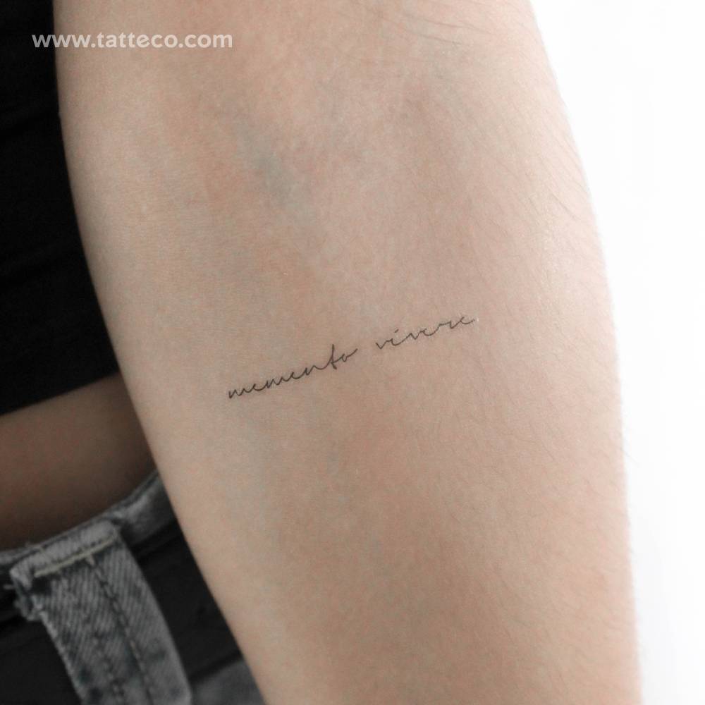 Handwritten font "memento vivere" temporary tattoo located on the inner forearm.