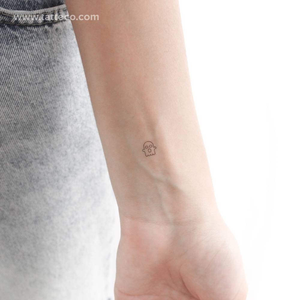 Tiny minimalistic ghost temporary tattoo located on the wrist.