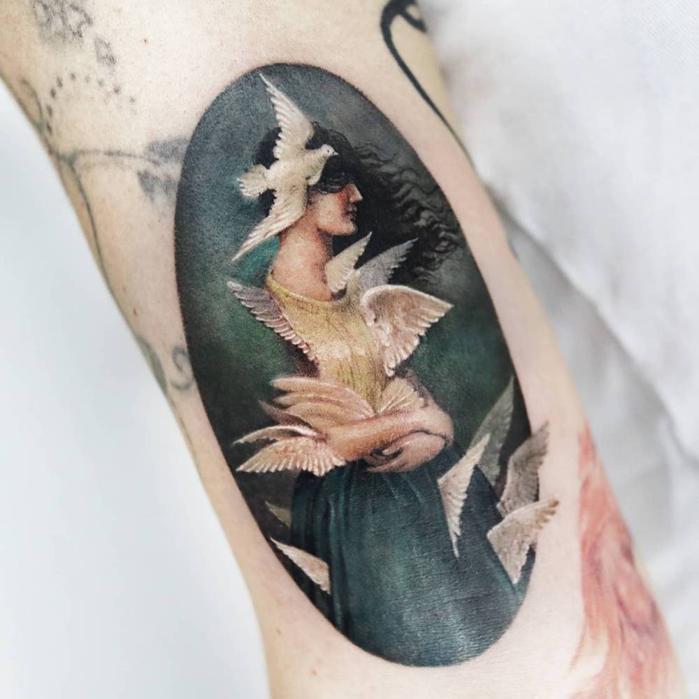 'Metamorphosis' by Christian Schloe tattooed on the bicep.