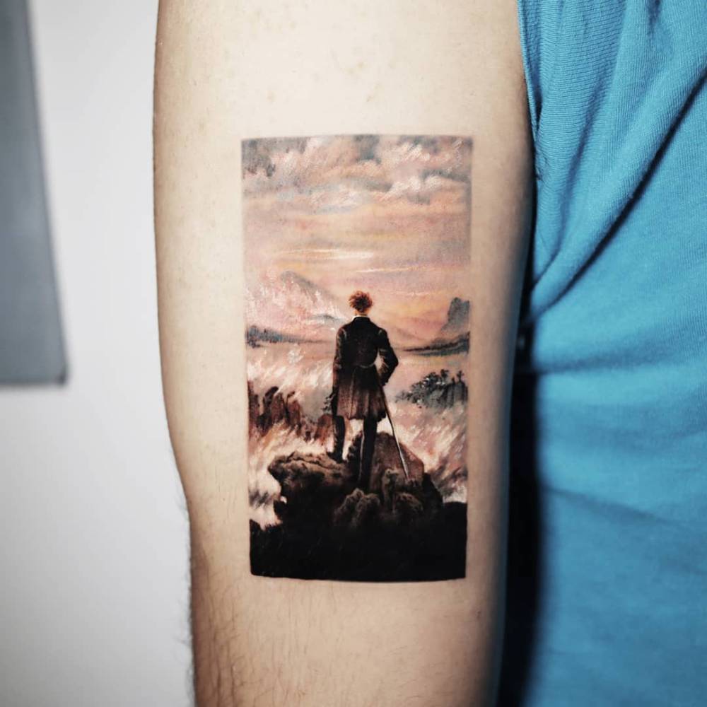 'Wanderer above the Sea of Fog' tattoo located on the upper arm.