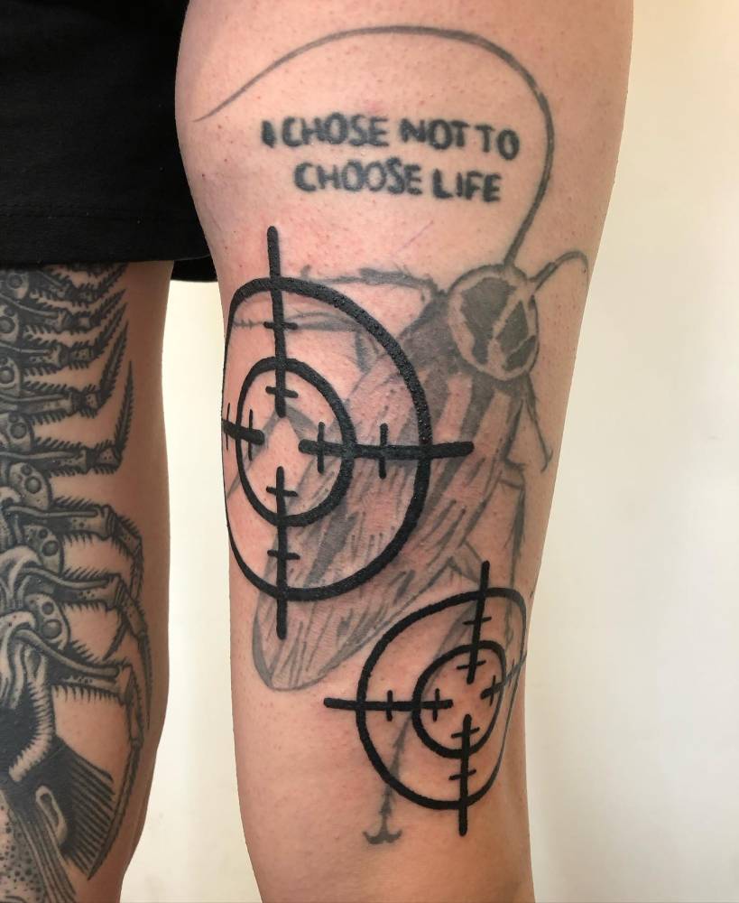 Targets tattoo in blackwork style located on the thigh.