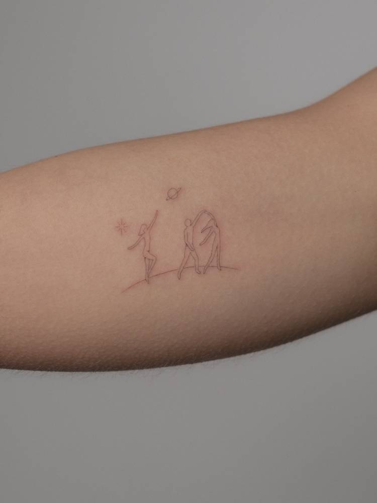 Single needle dancers tattoo located on the inner arm.