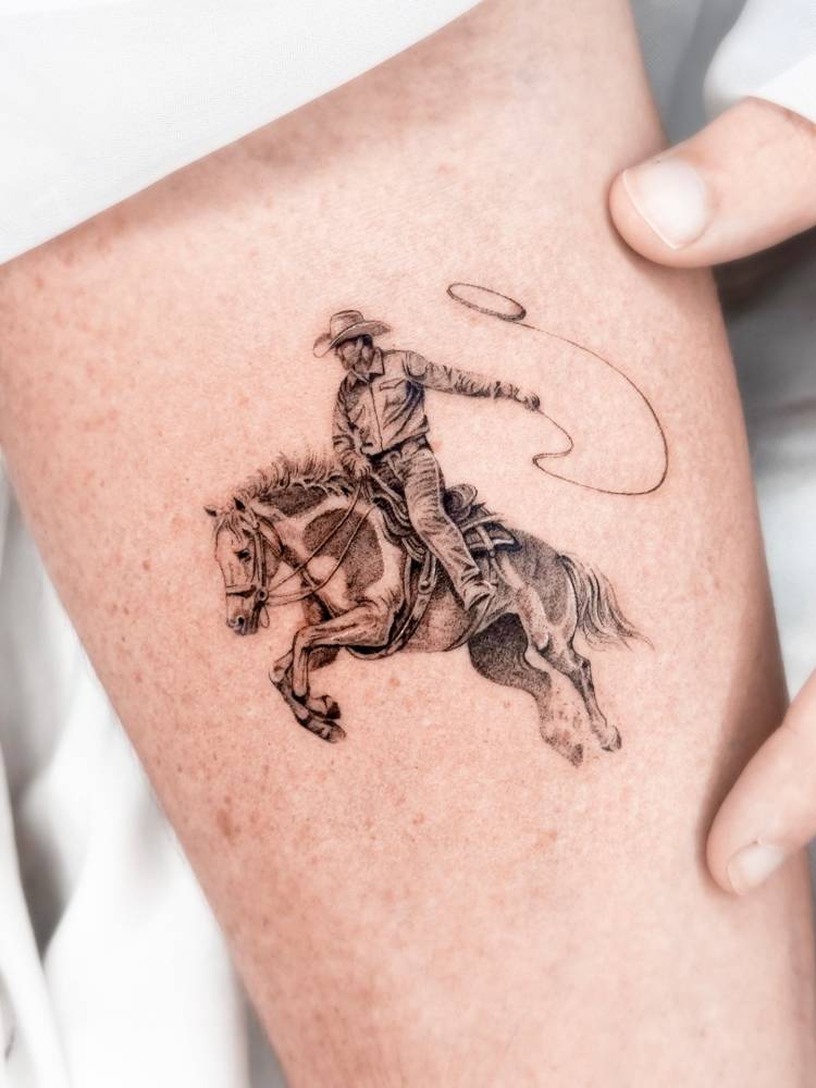 Cowboy tattoo in micro-realistic style placed on the inner forearm.