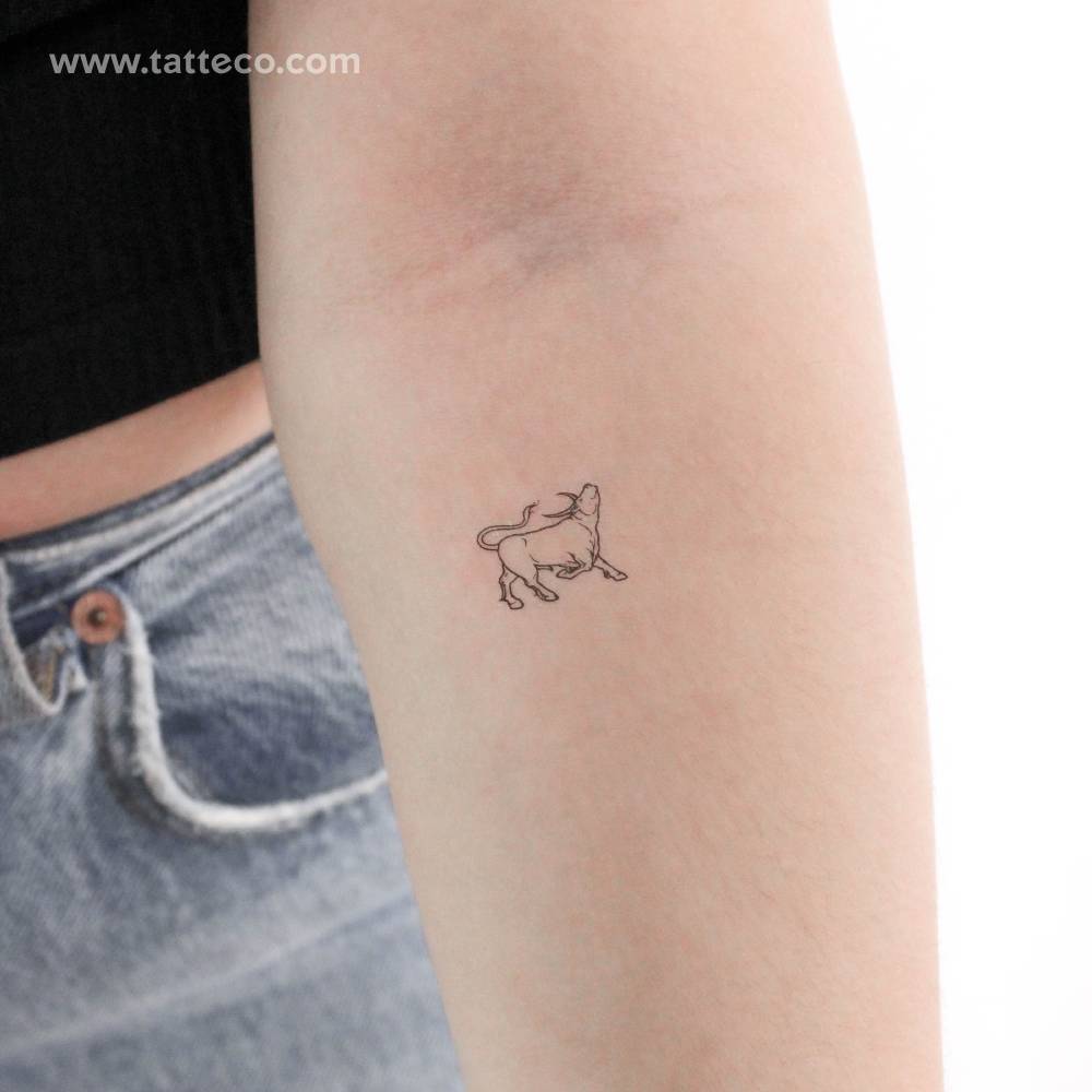 Bull temporary tattoo in fine line style located on the inner forearm.