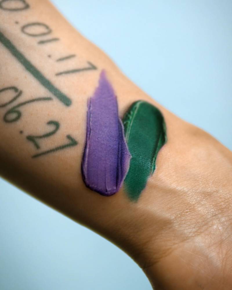 Brush strokes tattoo in watercolor style done on the wrist.