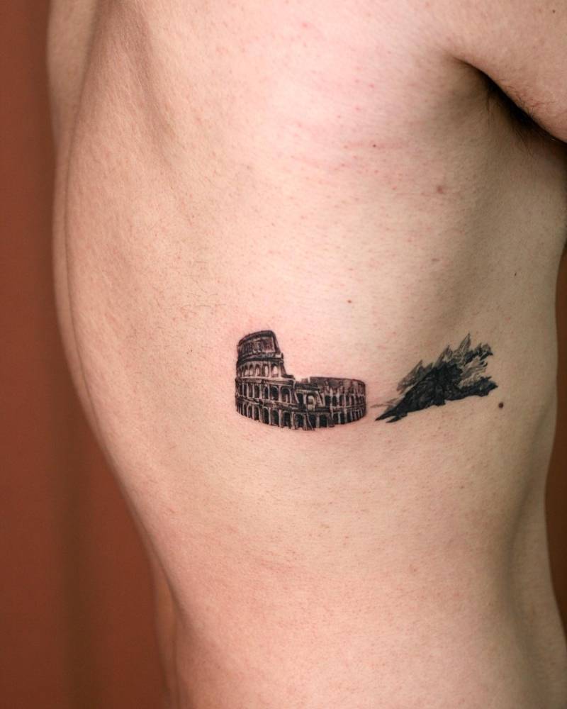 Colosseum tattoo done on the rib, micro-realistic style.