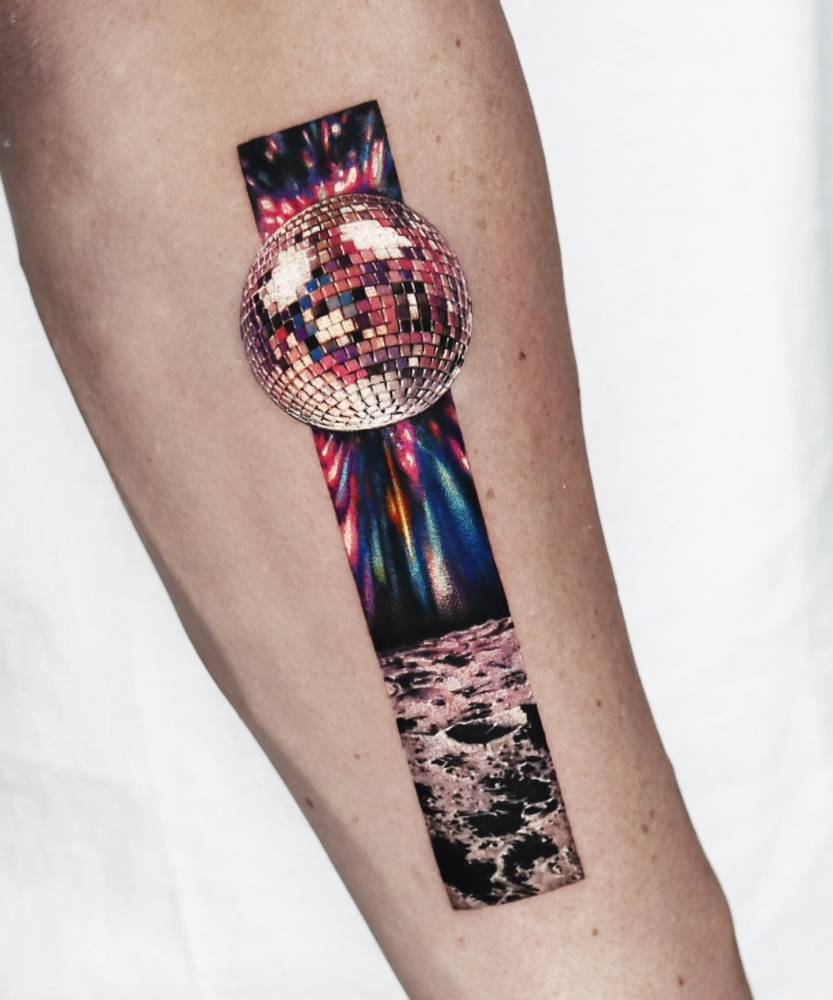 Disco ball tattoo placed on the forearm, done in micro-realism.