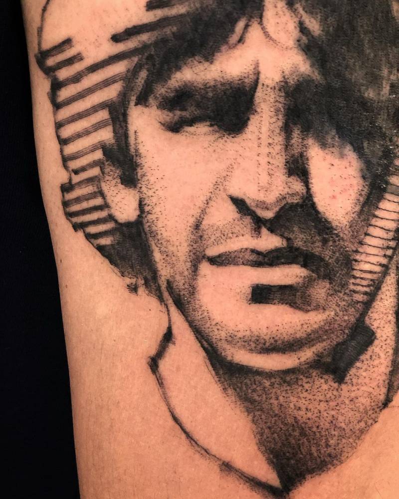 Sketch work Maradona portrait tattoo on the upper arm