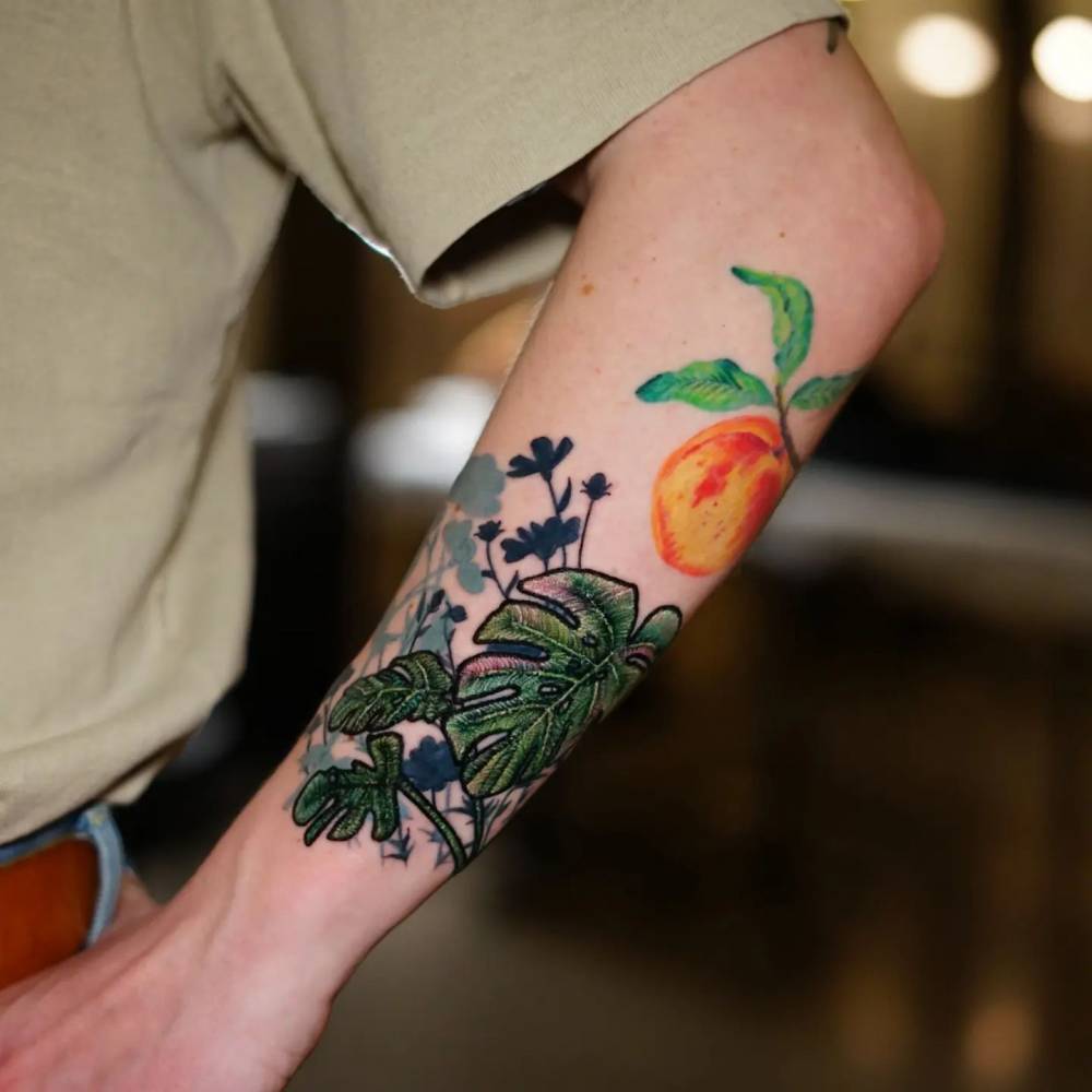 Embroidery style monstera tattoo located on the forearm.