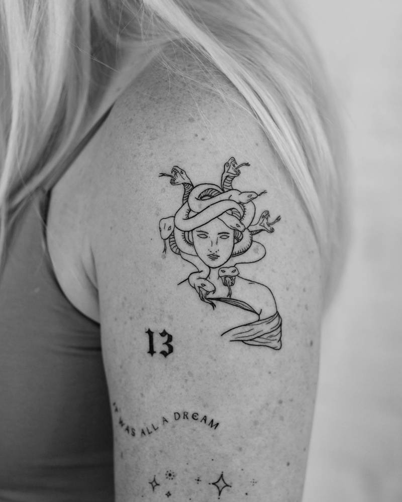 Upper arm composition tattoos.