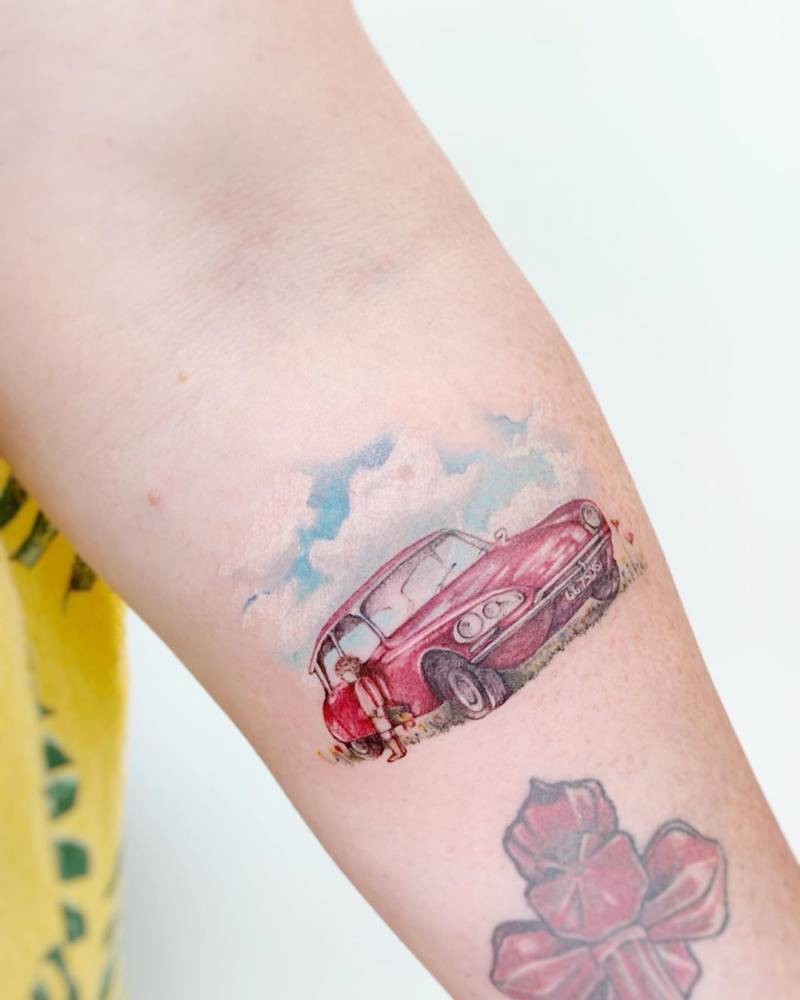 Citroën DS tattoo located on the inner forearm, watercolor style.