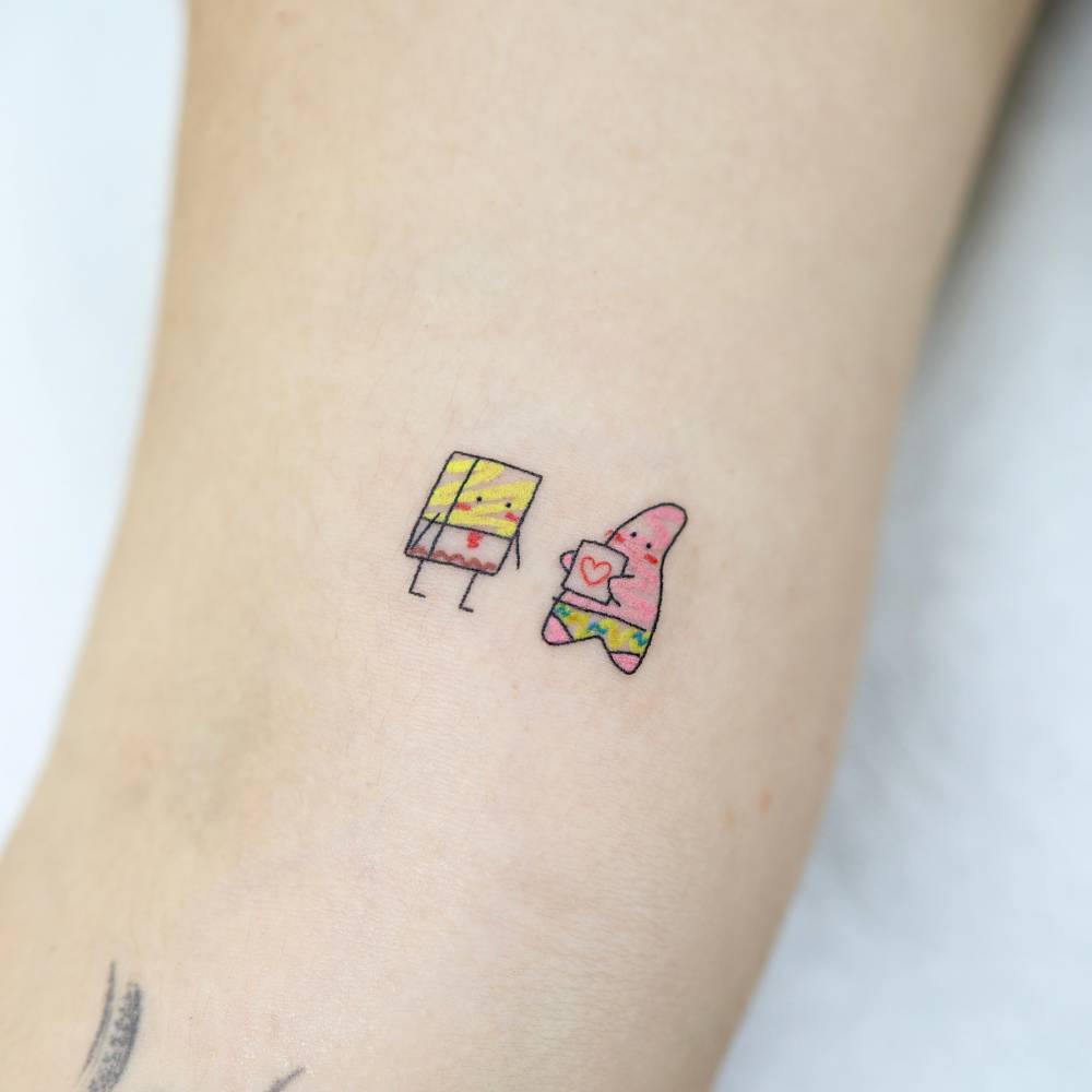 Spongebob and Patrick Star tattoo located on the inner arm.
