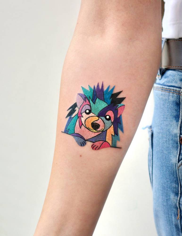 Hedgehog portrait tattoo in pop art style located on the inner forearm.