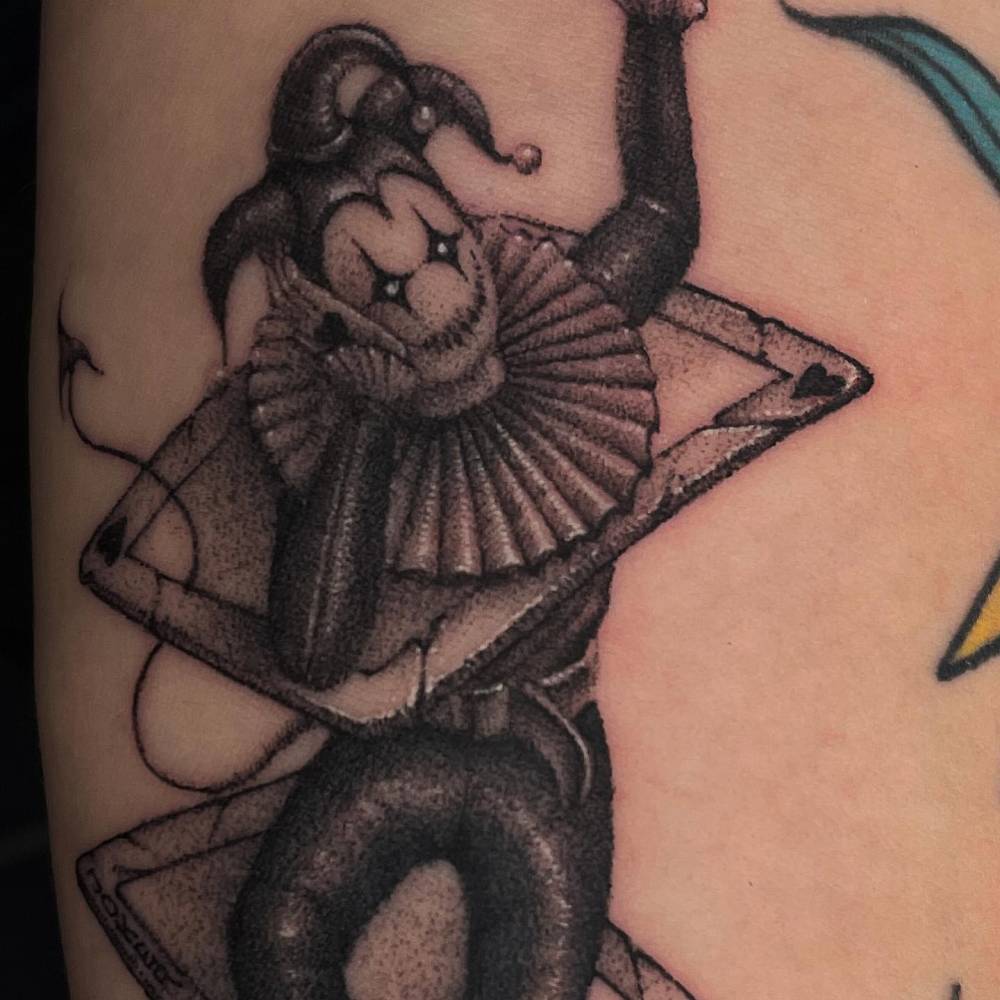 Illustrative style Joker tattoo done on the inner forearm.