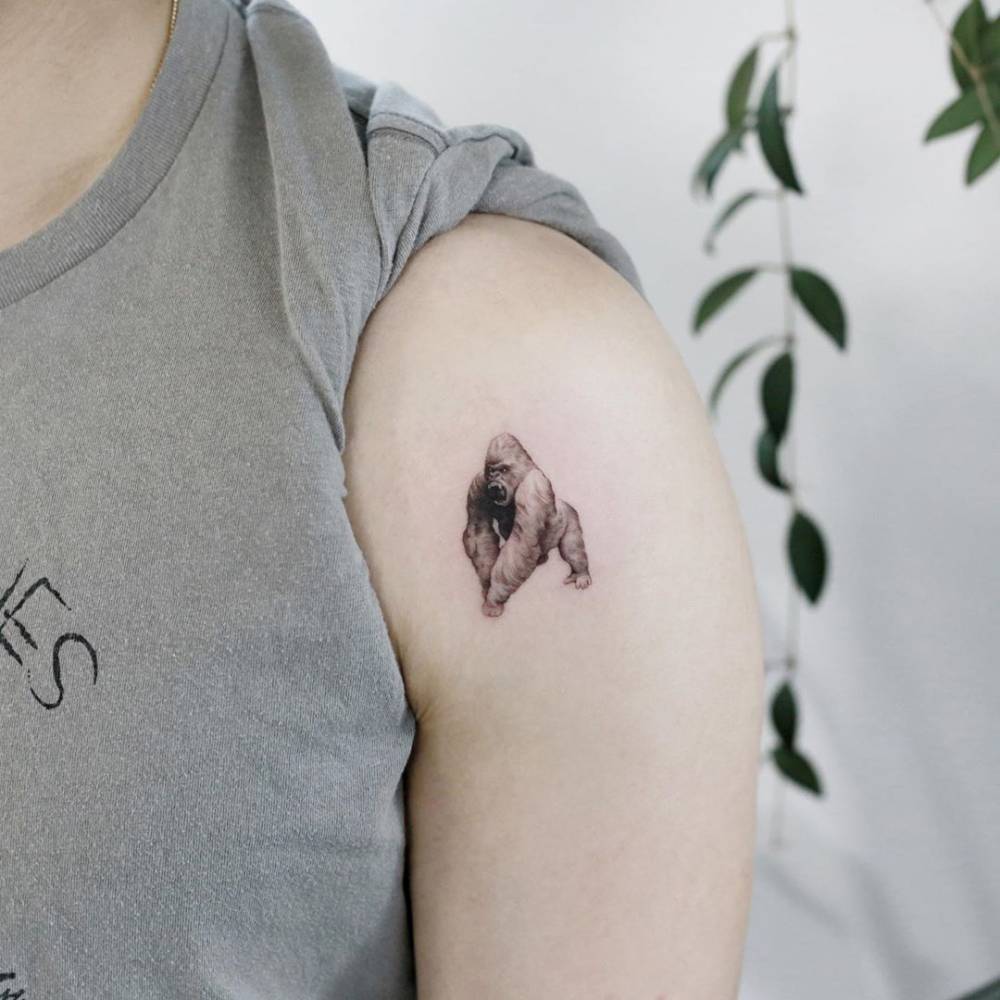 Micro-realistic style silverback gorilla tattoo placed on the shoulder.