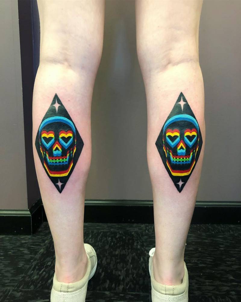 Heart skulls tattoo in pop art style located on the calves.
