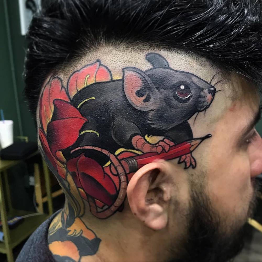 Rat tattoo in neotraditional style done on the head.