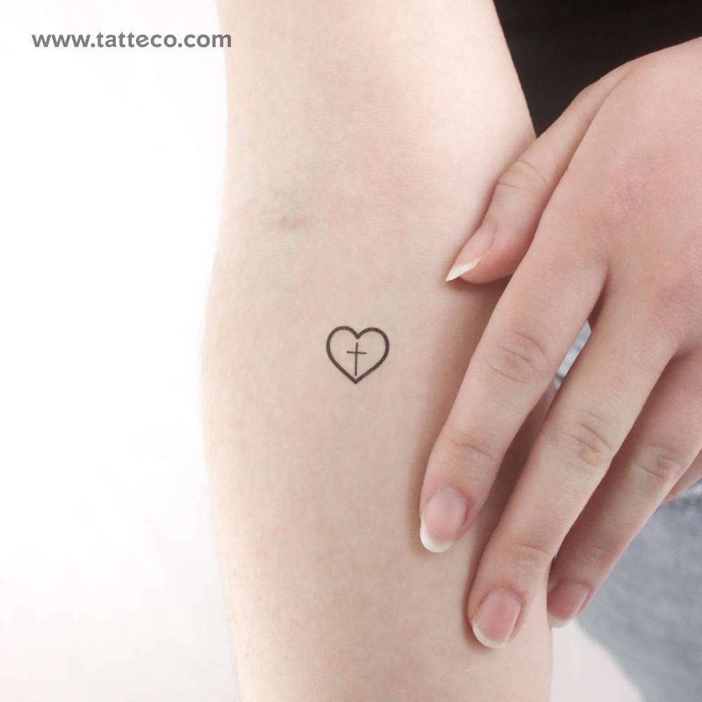 Minimalistic style cross inside heart temporary tattoo.