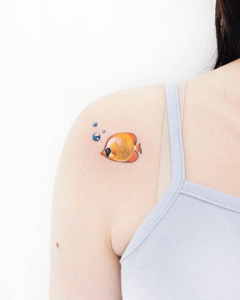 Butterflyfish tattoo located on the shoulder.