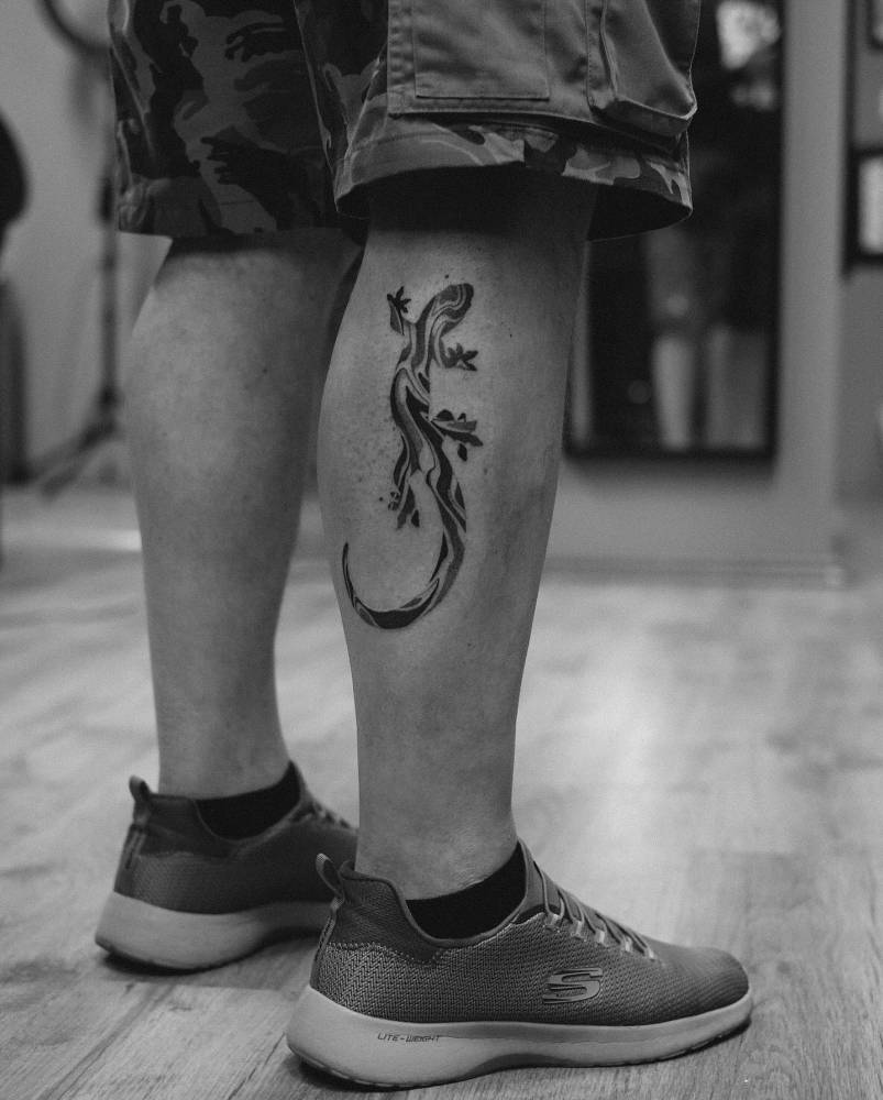 Freehand Salamander tattoo located on the calf.